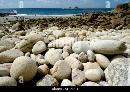 Porth Nanven beach Cot Valley Nr St Just Cornwall England with large granite pebbles looking W towards The Brisons Stock Photo