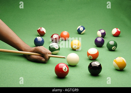 VDA79710 Snooker pool balls with player hitting the ball Stock Photo