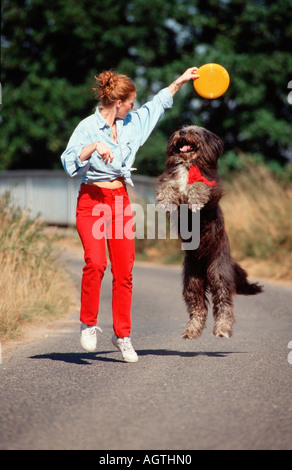 Woman with Mixed Breed Dog Stock Photo