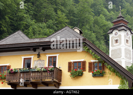 House facade and belfry of parish church of Hallstatt village. Salzkammergut, Austria. Stock Photo