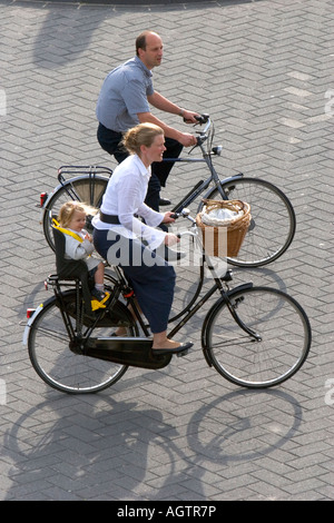 A family riding bicycles at The Hague in the province of South Holland Netherlands Stock Photo