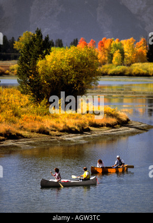 Canoes on Oxbow Bend of the Snake River in Grand Teton National Park with fall colors surrounding them. Stock Photo