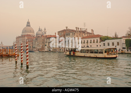 A vaporetto waterbus on the Grand canal near the Accademia Bridge in Venice Stock Photo