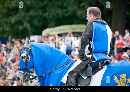 Medieval knight on horseback during reenactment tournament Stock Photo