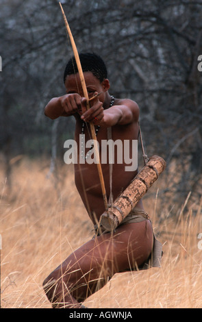 Bushman San man hunting with bow and arrow Kalahari Northern Cape Stock ...