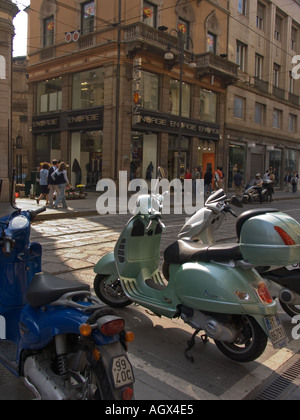 Scooters parked on sidewalk of Via Torrino in Milan Italy Stock Photo