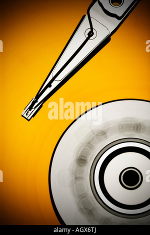 Computer hard drive with a spinning disc in yellows Stock Photo