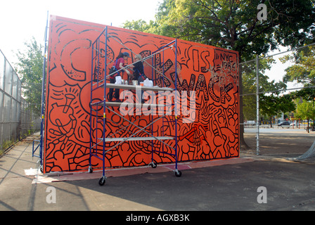 Workers restore the famous Keith Haring Crack is Wack mural in Harlem River Park in NYC The mural was originally painted in 1986 Stock Photo