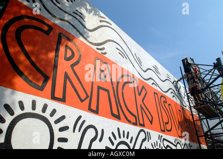 Workers restore the famous Keith Haring Crack is Wack mural in Harlem River Park in NYC The mural was originally painted in 1986 Stock Photo