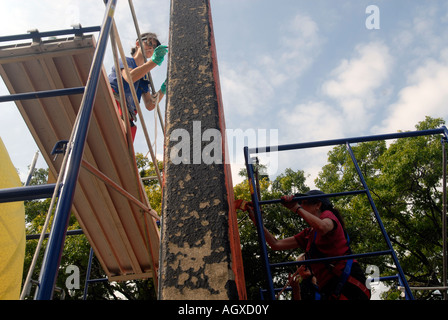 Workers restore the famous Keith Haring Crack is Wack mural in Harlem River Park in NYC The mural was originally painted in 1986 Stock Photo