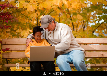 Father and son doing homework together Stock Photo