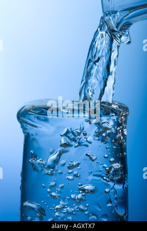 Pouring water into glass. High speed photography Stock Photo