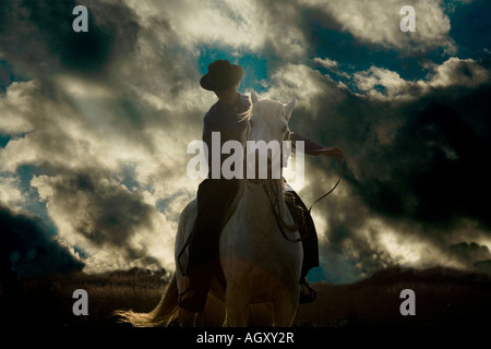 French farm girl on a white horse of the Camargue, Provence, France Stock Photo