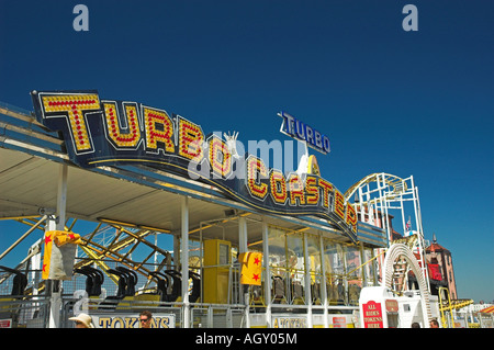 Turbo Coaster fair ride on the Brighton Pier, Brighton. Stock Photo