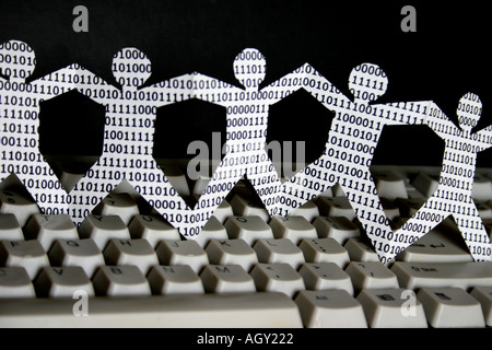 symbolic knowledge workers in the information technology industry paper dolls with binary numbers Stock Photo