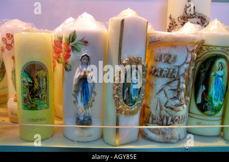 souvenirs for pilgrims in Lourdes Hautes Pyrénées France Stock Photo