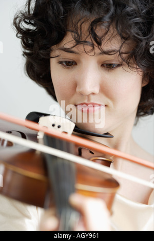 Woman playing the violin Stock Photo
