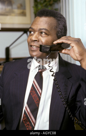 Black male business man talking on telephone Stock Photo