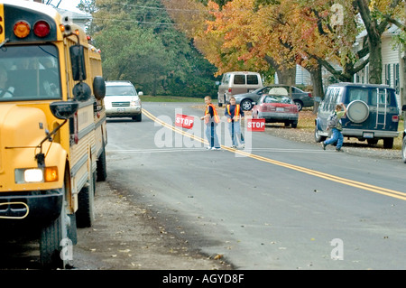 Amish life in Millersburg and Sugar Creek Holms County Ohio School crossing guards with flags to stop traffic Stock Photo