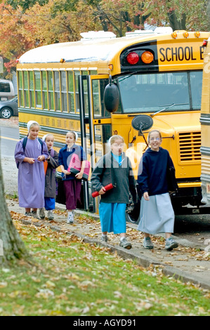 Amish life in Millersburg and Sugar Creek Holmes County Ohio School children boarding a school bus Stock Photo