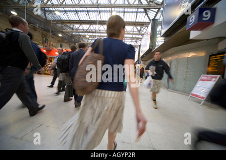 Commuters hurrying across concourse at Waterloo Station London Stock Photo