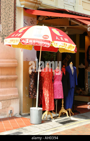 Singapore China town dress shop with dresses displayed  on dress makers dummies Stock Photo