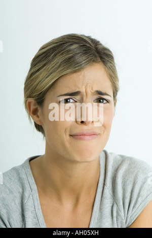 Young woman making face, portrait Stock Photo