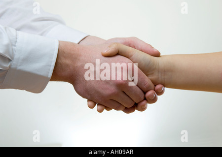 two handed hand shake by business man and woman Stock Photo