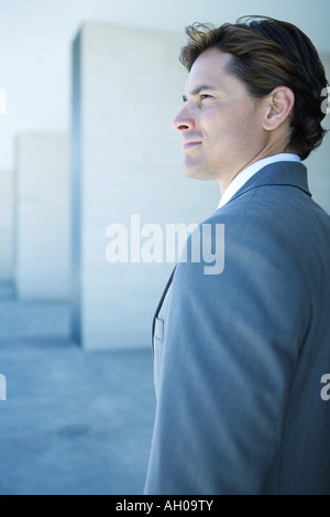 Young businessman looking away, profile, portrait Stock Photo
