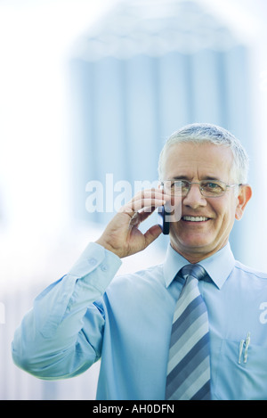 Businessman using cell phone Stock Photo