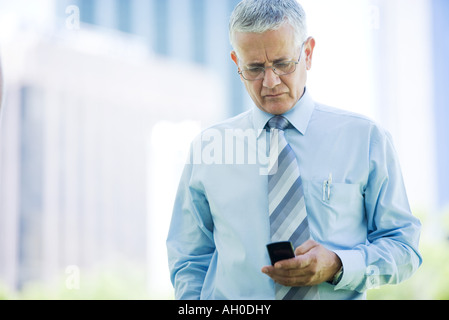 Businessman using cell phone Stock Photo