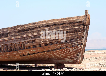 Old decaying fisherboat wreck abandoned on the shores of Paracas Peru Once a proud boat now abandoned and decaying Stock Photo