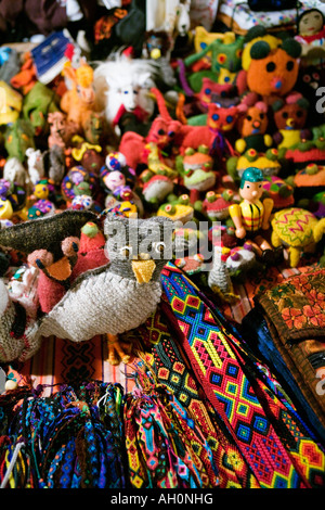 Close up of Mexican fabric crafts focused on knitted owl figure Stock Photo