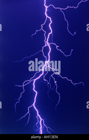 Lightning bolt slicing night sky Stock Photo
