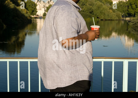 Overweight man with a soft drink Stock Photo