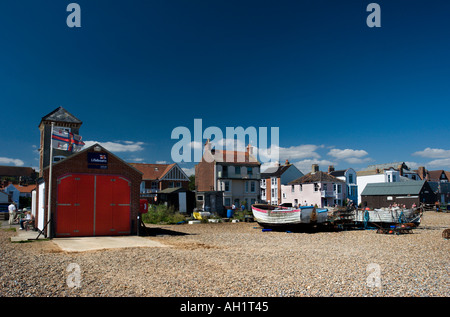 The old RNLI lifeboat station and old fishing boats on the beach at Aldeburgh in Suffolk Stock Photo