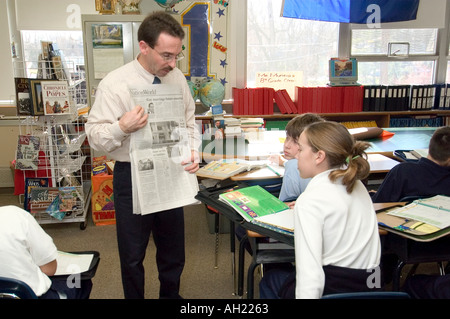Student teacher interaction in a Catholic Elementary School Educational Setting Stock Photo