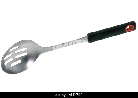 Slotted spoon with black silicon handle silhouetted on white background Stock Photo