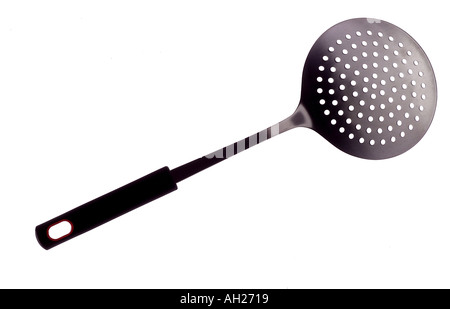 big straining spoon silhouetted on white background Stock Photo