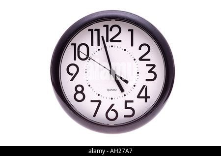 wall clock four fifty eight 4 58 silhouetted on white background Stock Photo