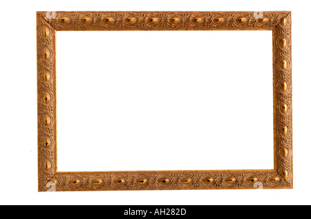 An antique, gold, painted picture frame silhouetted on white background Stock Photo