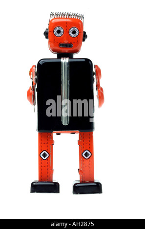 An antique toy metal robot silhouetted on white background Stock Photo