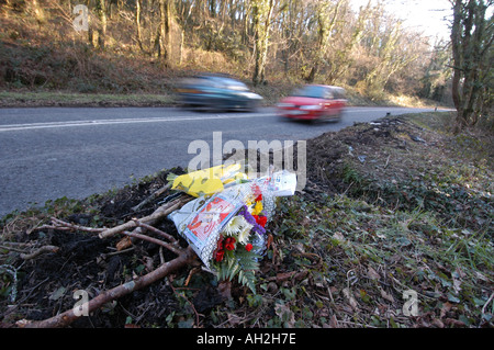 Floral tributes laid by the side of a road Stock Photo