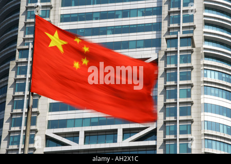 Chinese flag and modern office buildings Shanghai China Stock Photo