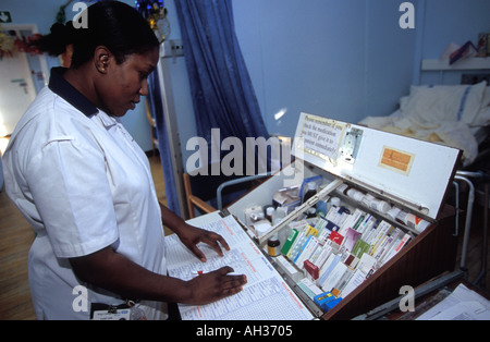 Staff nurse on geriatric ward preparing to dispense medicine to patient's, Kings College Hospital, London, UK. Stock Photo