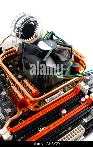 CPU cooler fan with radiator on a high end computer motherboard designed for overclocking Stock Photo