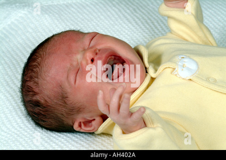 Crying Baby Girl at Four Weeks Old cries Stock Photo