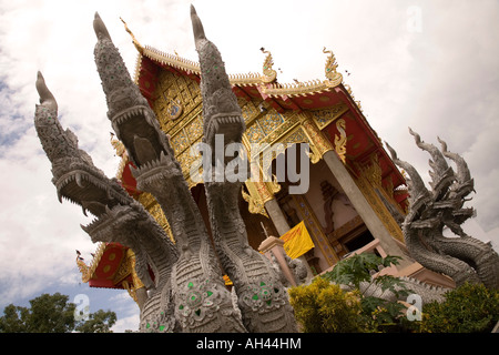 The front of Wat Munguan in Chiang Rai, complete with with Naga snake heads sculpture. Thailand. Stock Photo