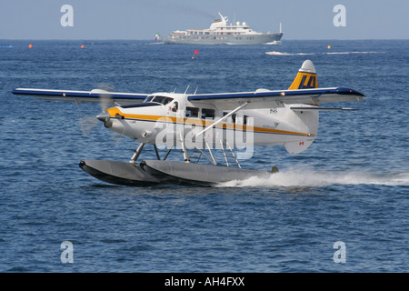 Air travel. Harbourair Malta DHC-3 Otter single engine propeller powered seaplane taking off from the water. Stock Photo