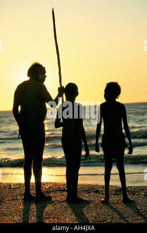 aboriginal with walking stick gazing at the sea, Darwin, Australia Stock Photo